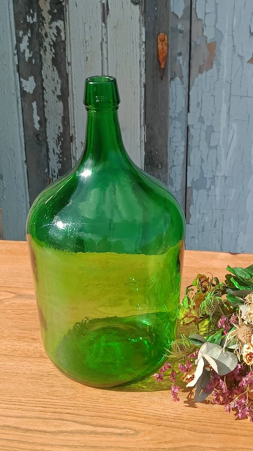 Superb antique green glass demijohn.