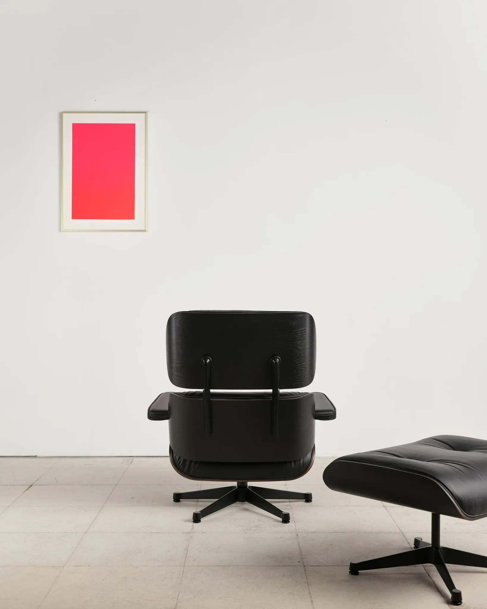 Lounge Chair and ottoman in black leather by Charles & Ray Eames, Vitra