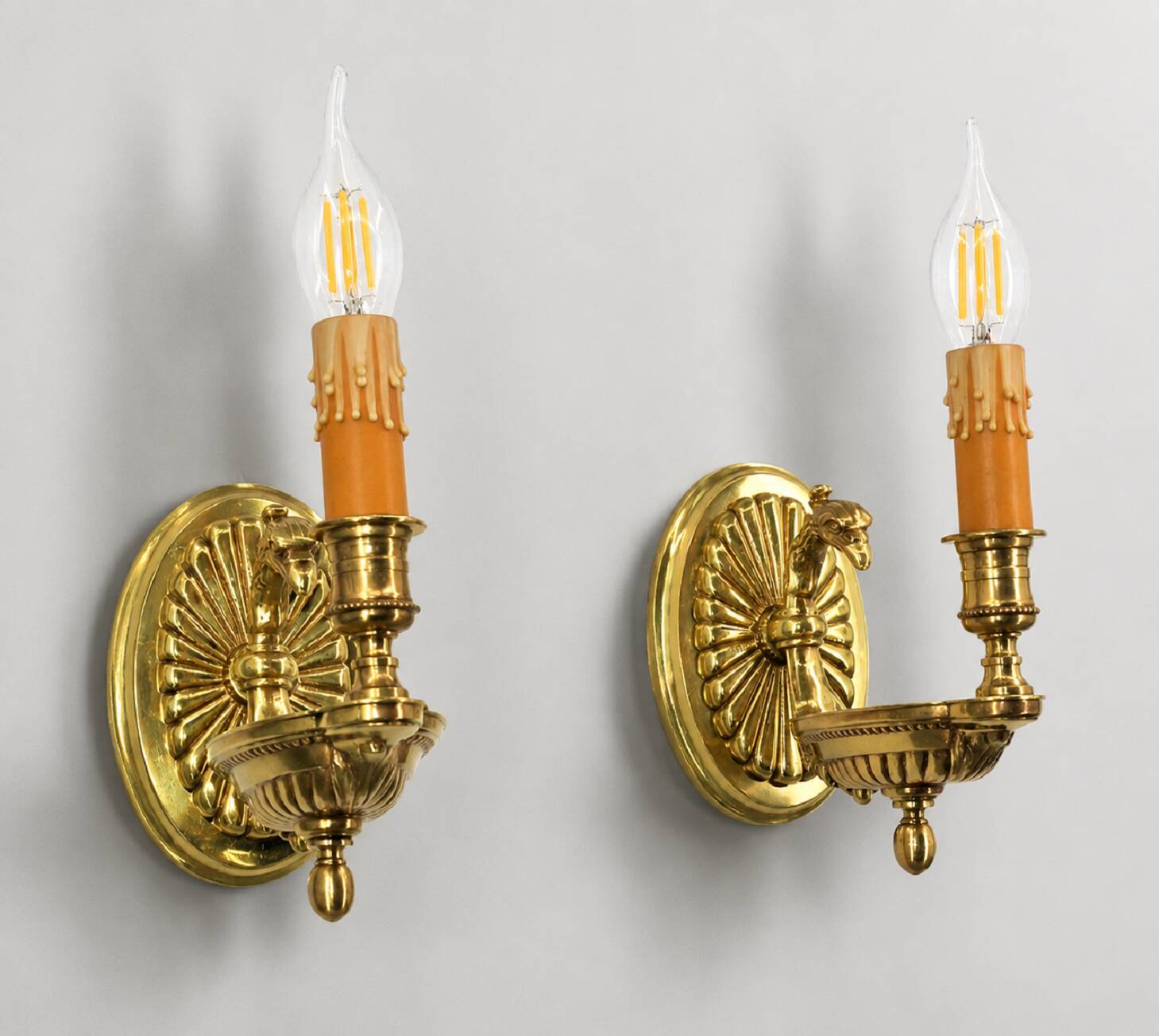 Pair of gilt bronze wall sconces in Directoire style by Lucien Gau.
