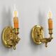 Pair of gilt bronze wall sconces in Directoire style by Lucien Gau.
