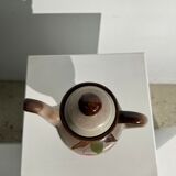 Vintage stoneware teapot with flower and fruit patterns