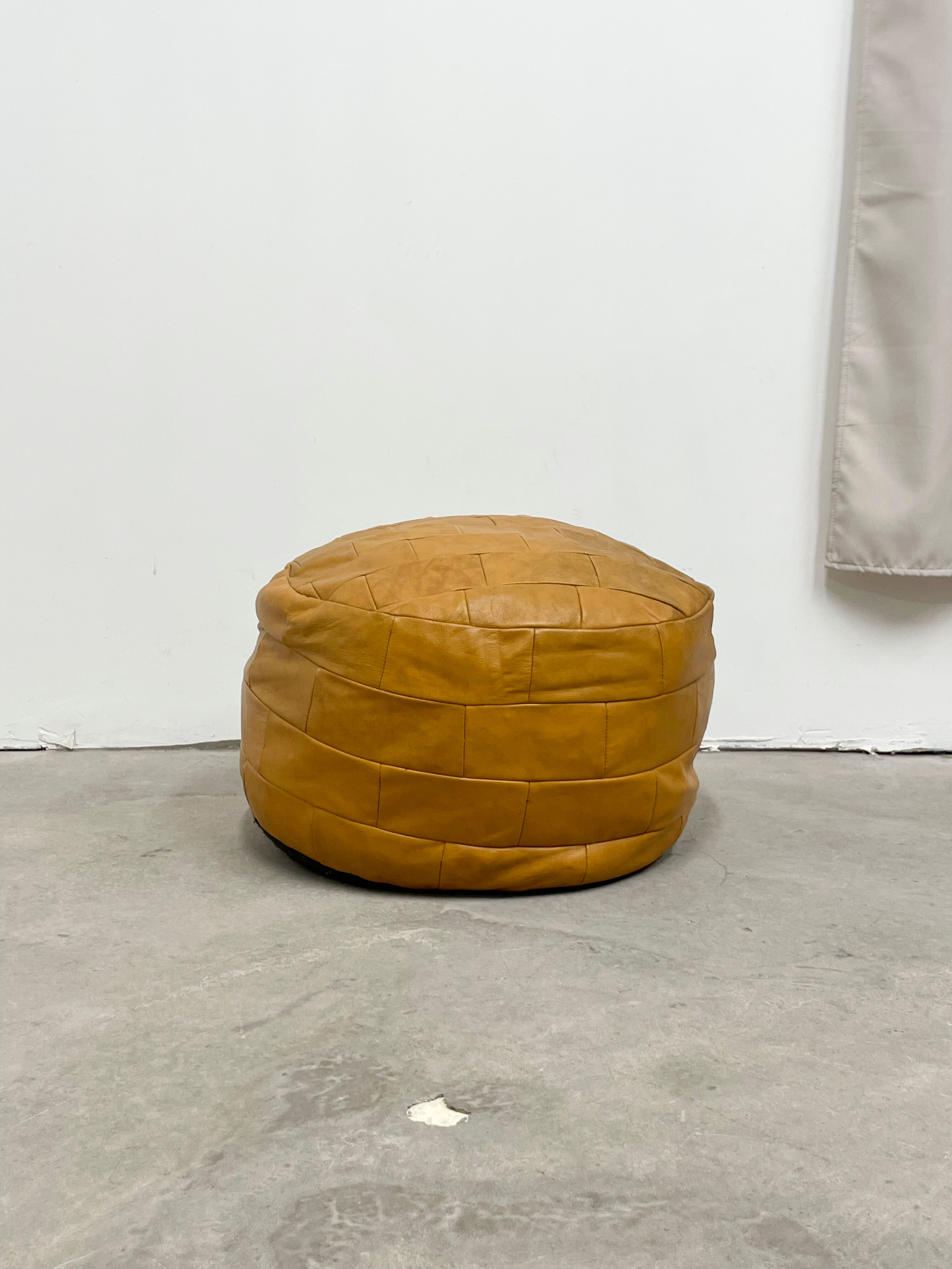 Ochre leather patchwork pouf