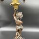 Candelabra with cherub in patinated bronze