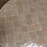Nomadic rattan table with zellige top