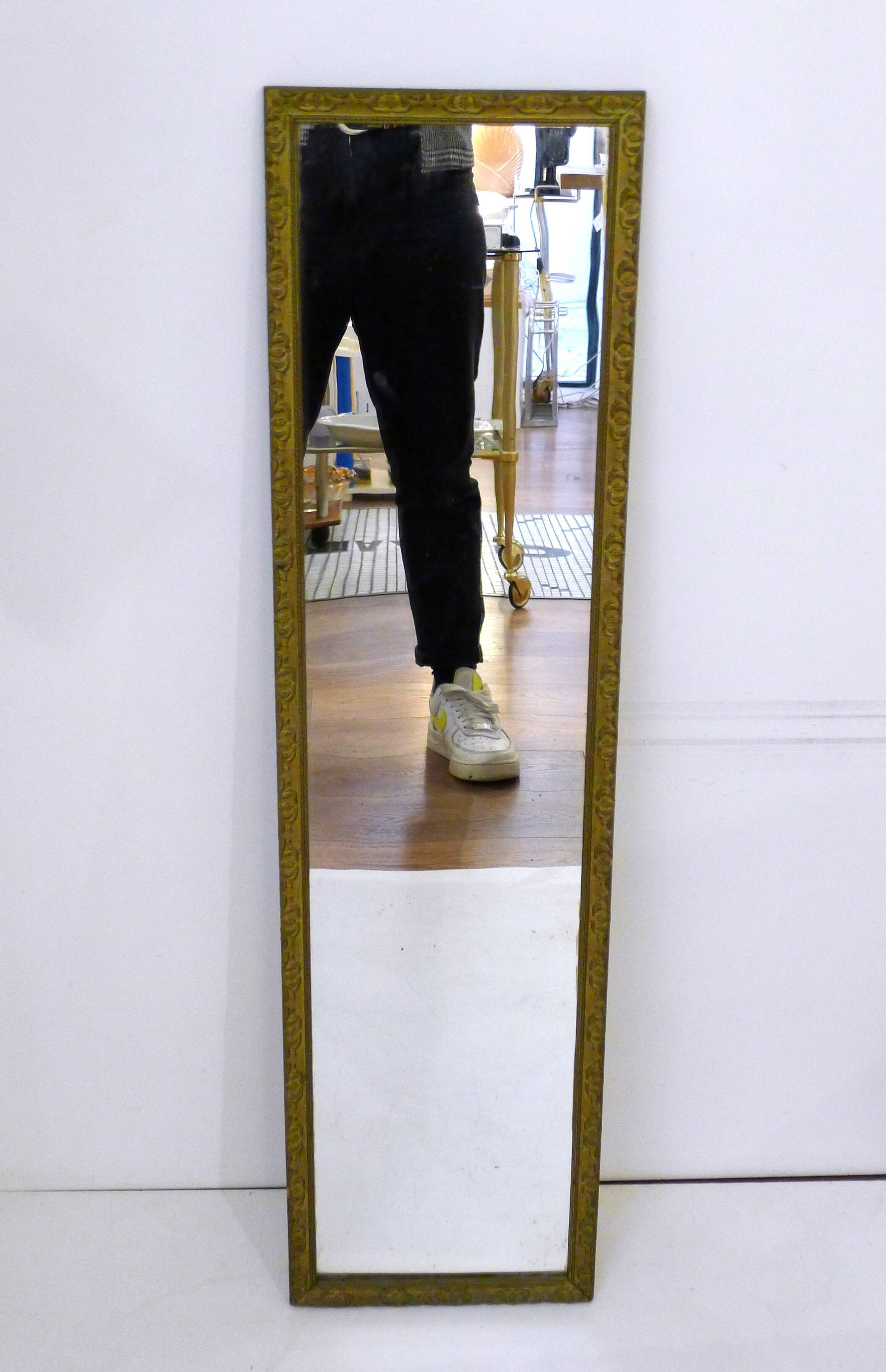 Large elongated gilded mirror