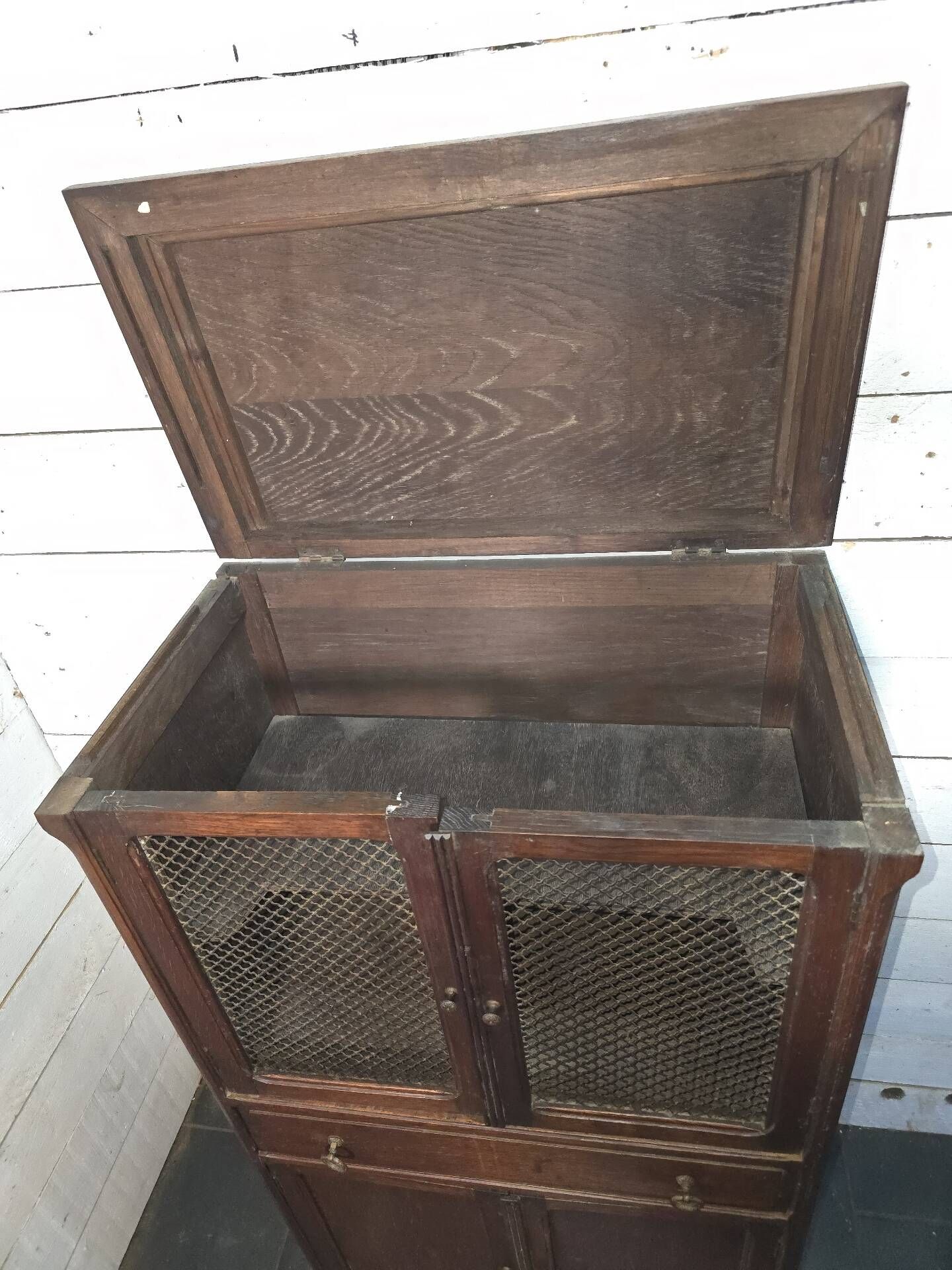 Vintage oak furniture with mesh doors.