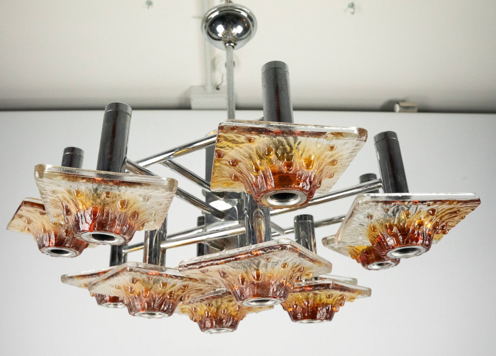 12-light Mazzega chandelier in amber and clear murano glass and chrome. Ita