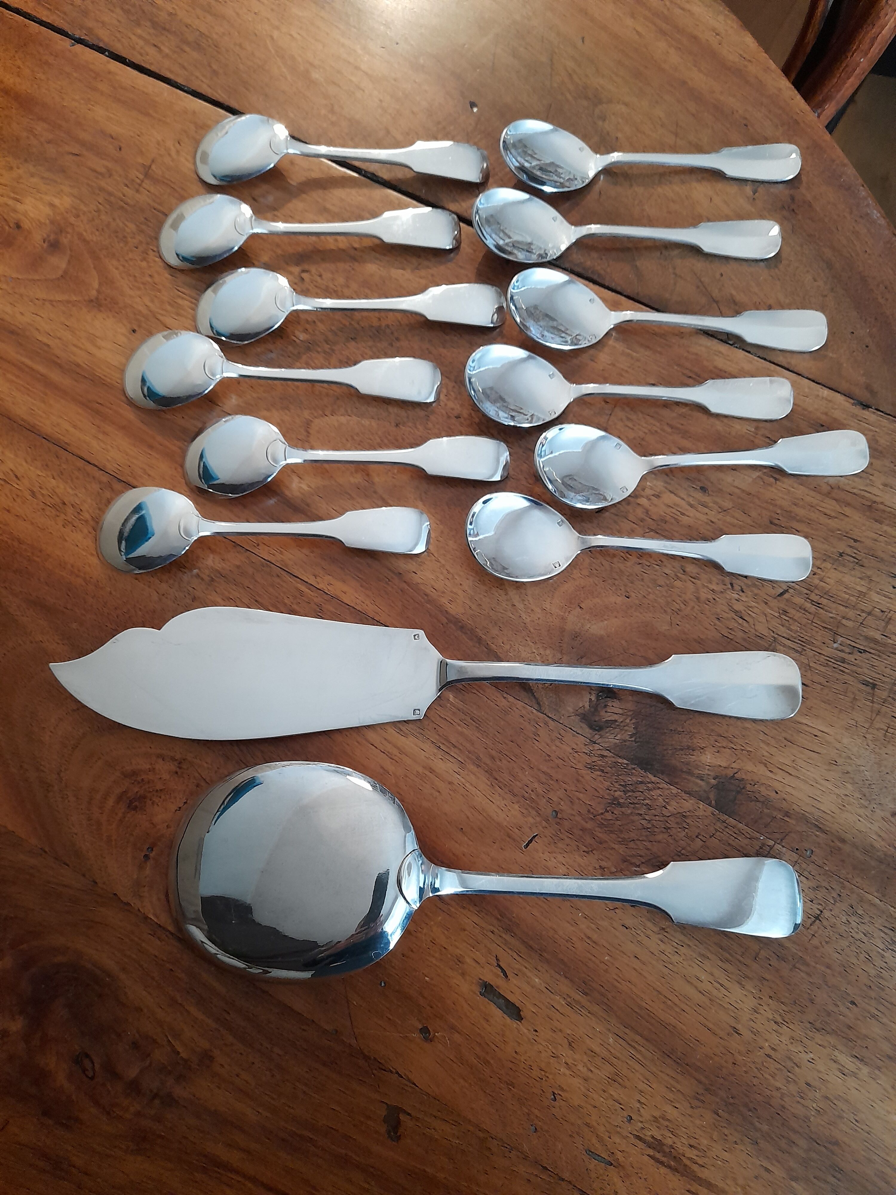 cutlery and spoons with ice and silver metal cake