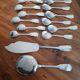 cutlery and spoons with ice and silver metal cake