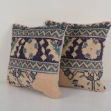 Set of two muted ecru carpet rug pillows