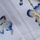 Set et sa serviette assortie motif Iris attribués à D. Porthault