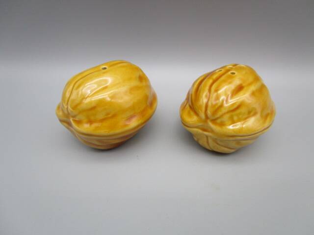 Pair of old earthenware salt/pepper shakers in “walnut” shape