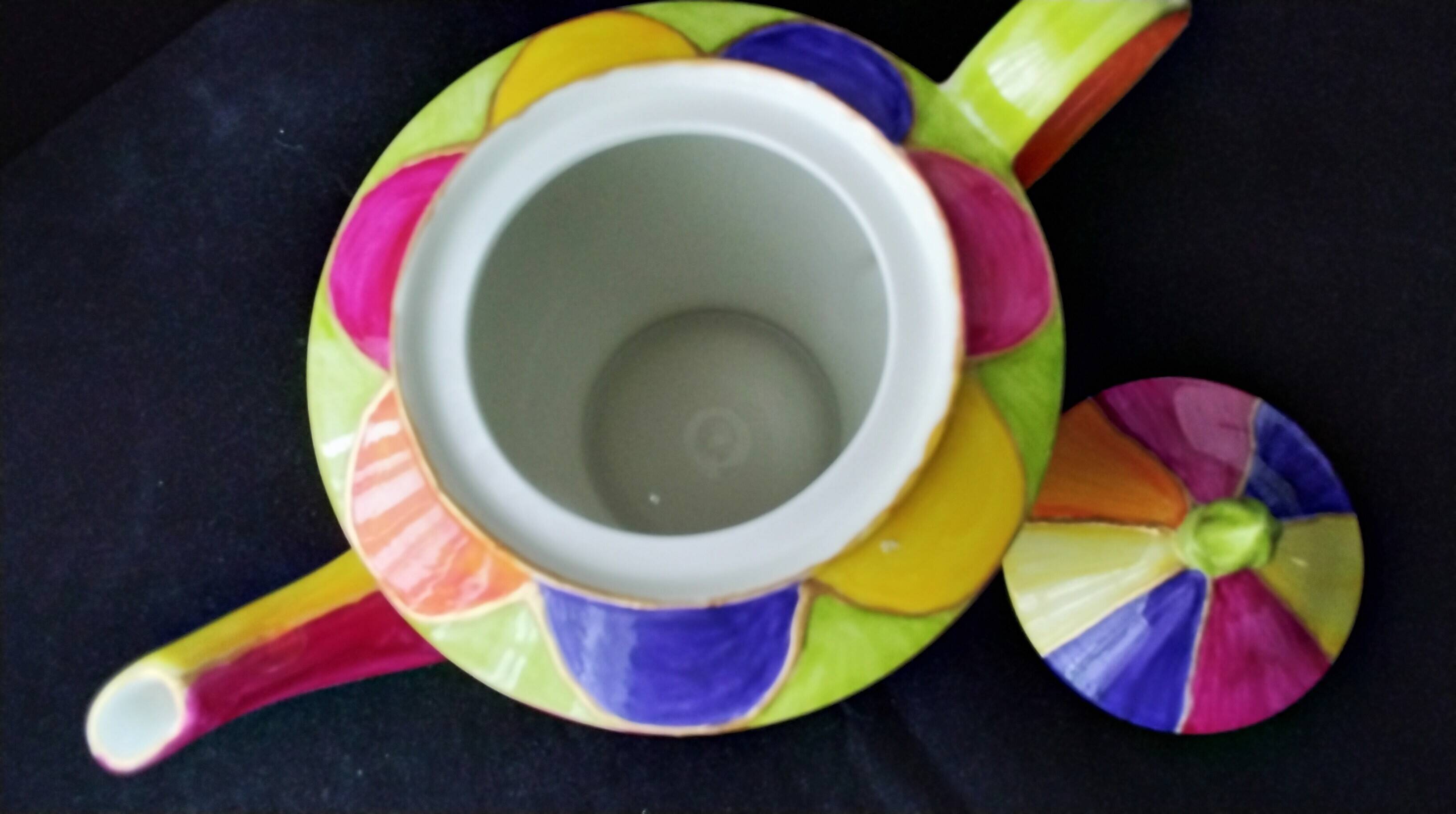 Polychrome porcelain teapot hand-painted.