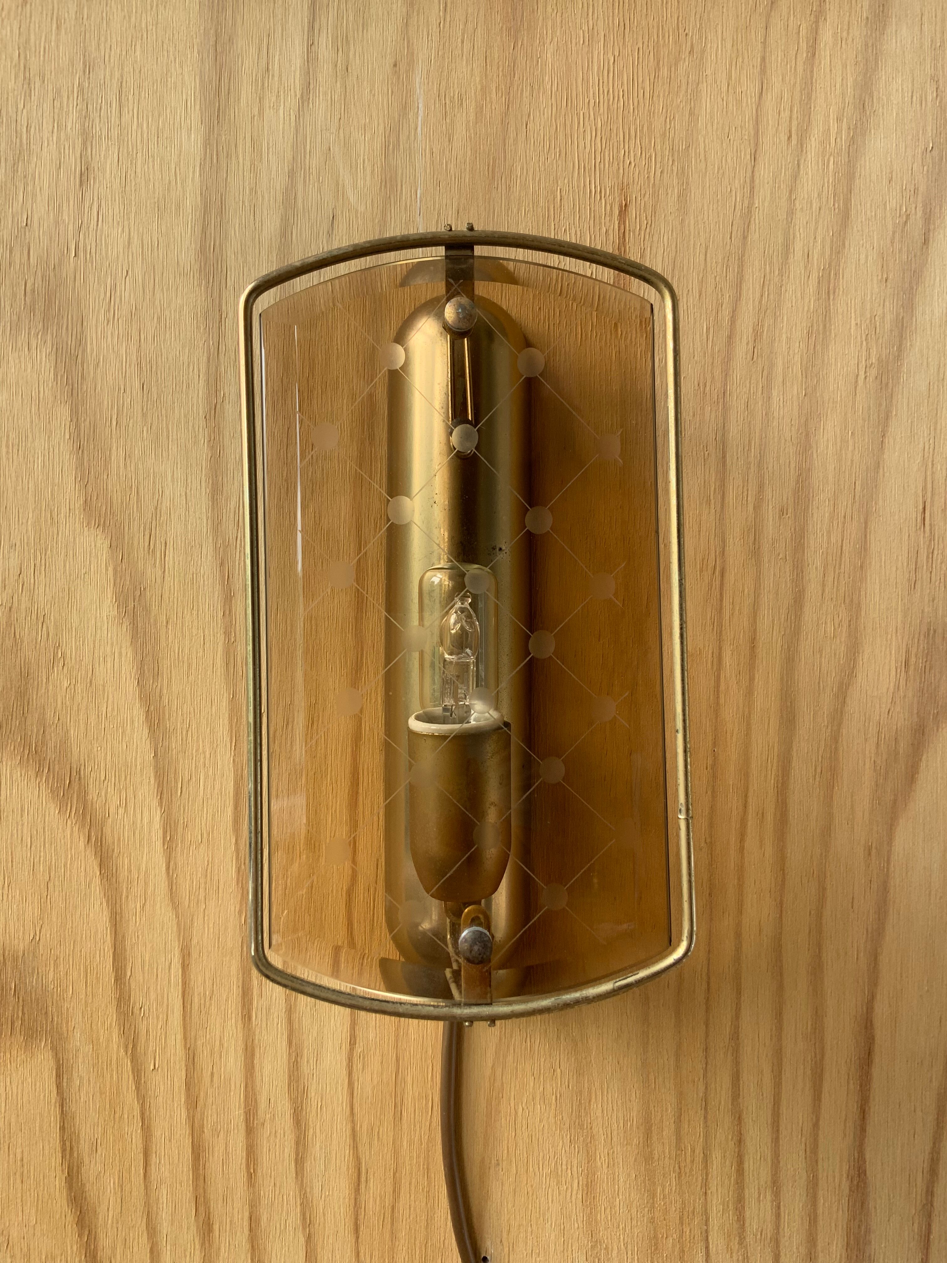 Brass wall lamp and smoked glass
