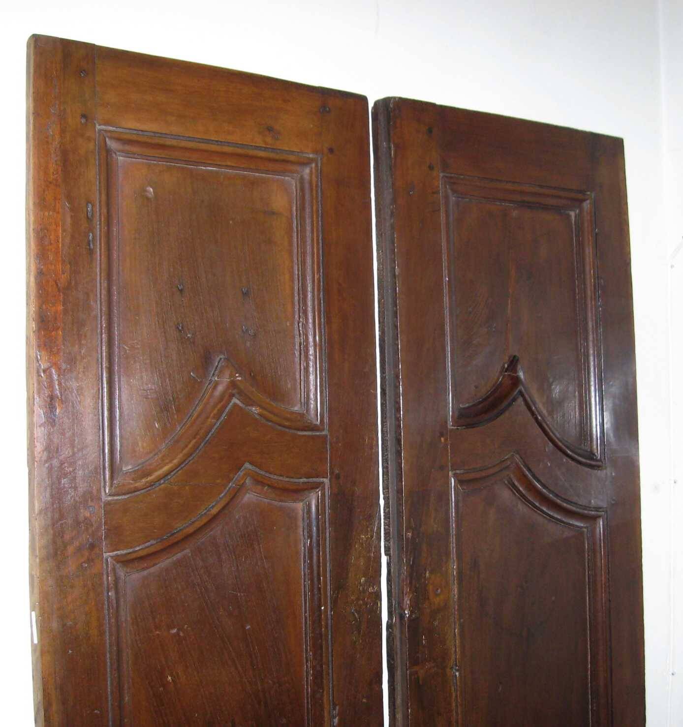 Pair of antique solid walnut doors from the 18th century.