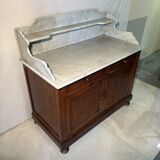 Antique wood and marble kitchen sideboard with carved backsplash