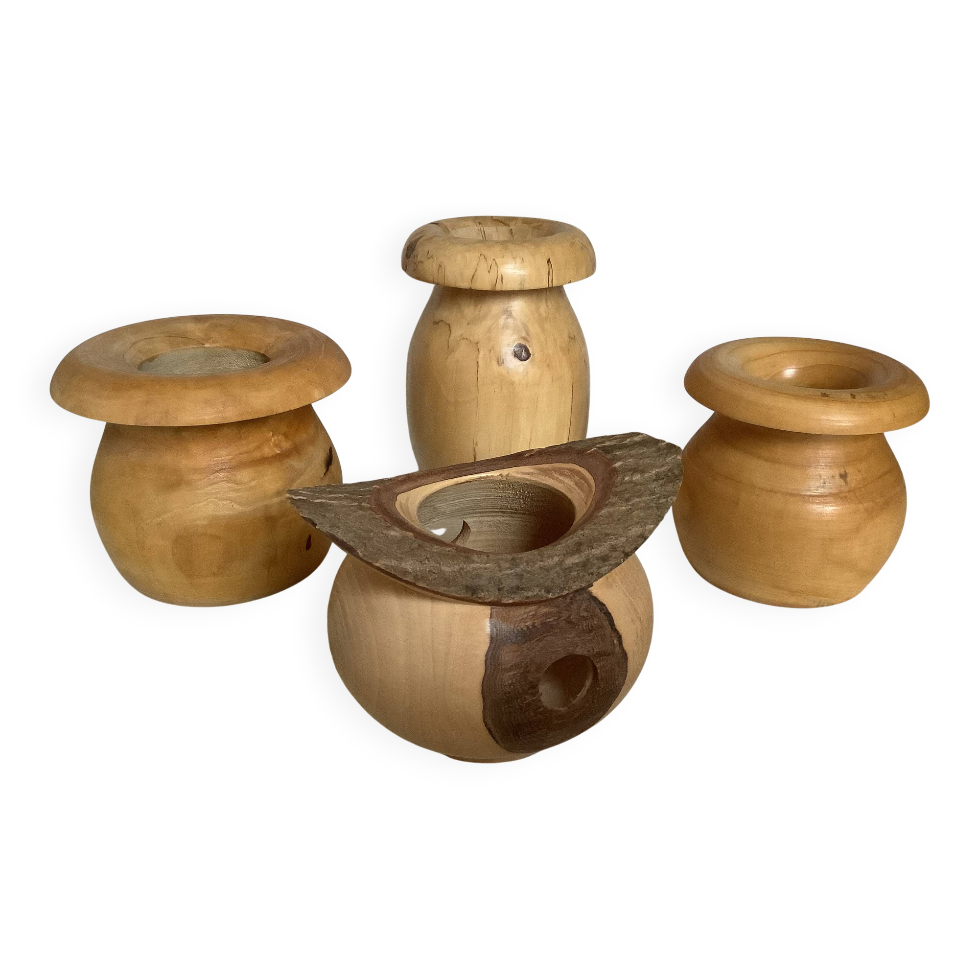 Four solid turned wooden vases