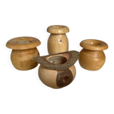 Four solid turned wooden vases