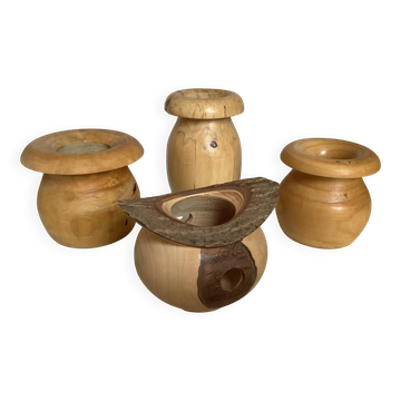 Four solid turned wooden vases