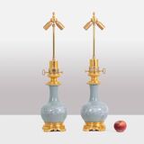 Pair of celadon porcelain and gilt bronze lamps. Circa 1880.