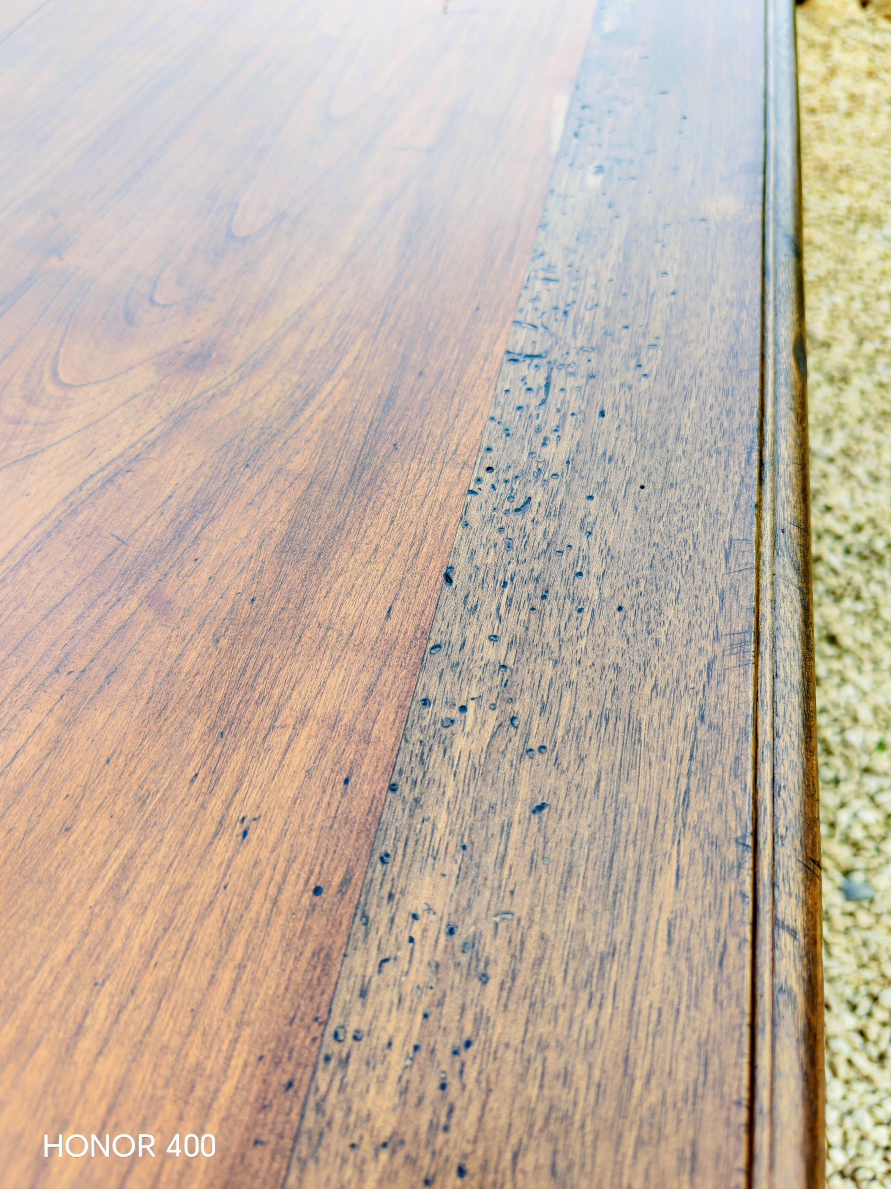 Old French farmhouse table in walnut with turned legs.