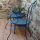 A pair of metal garden chairs