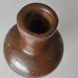 Bottle in varnished sandstone