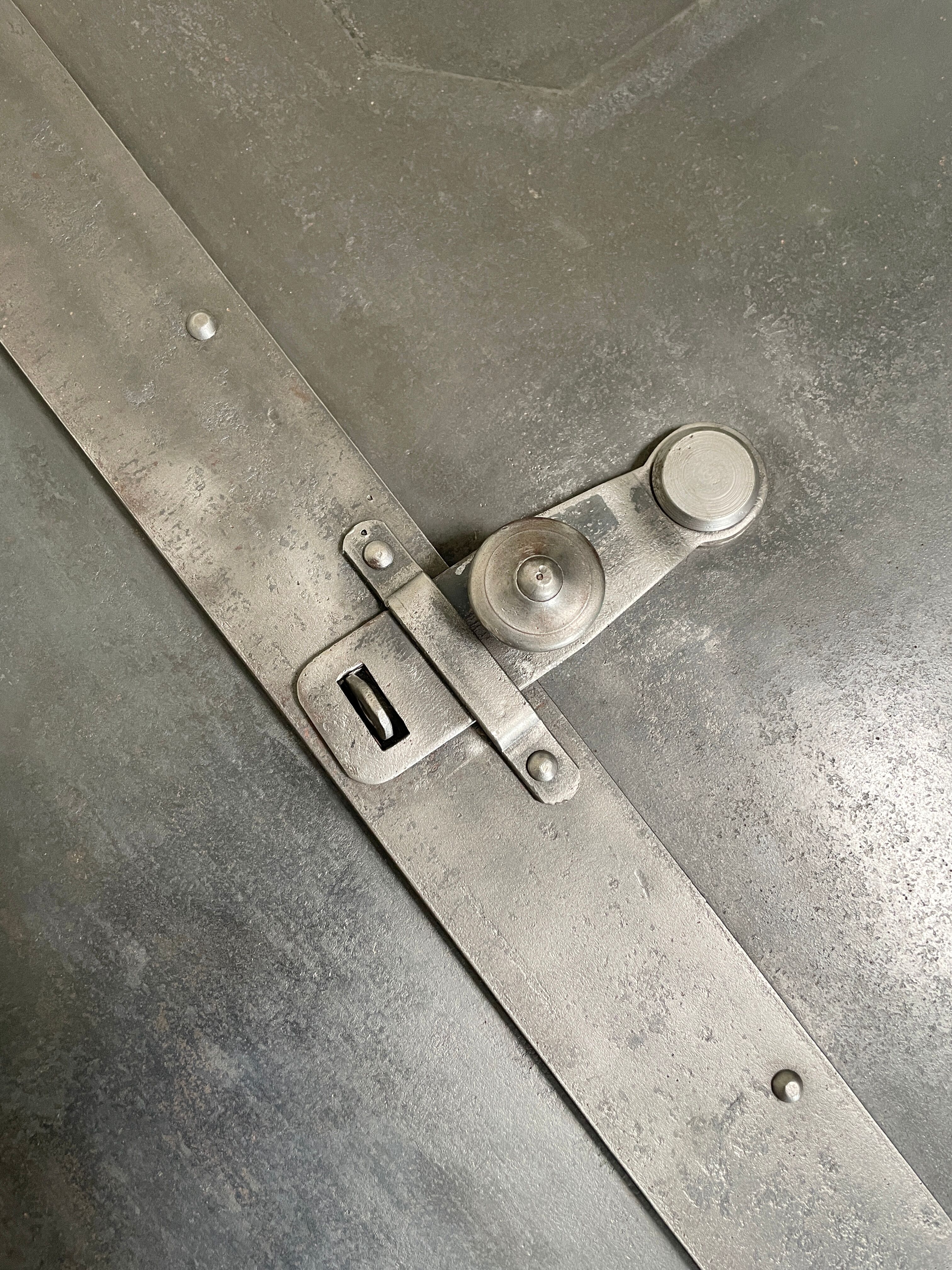 Industrial locker room in raw metal, circa 1930.