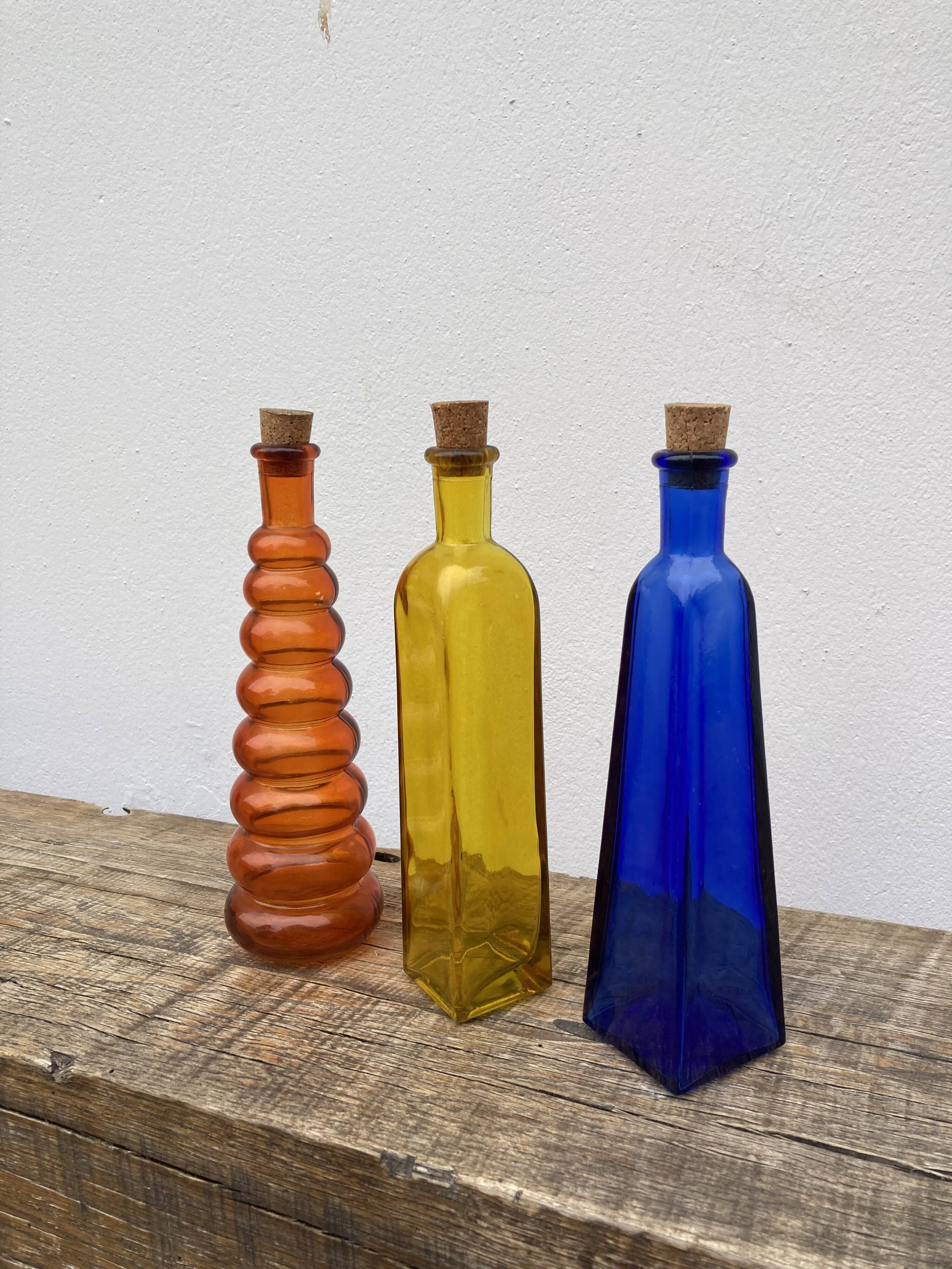 Trio of bottles 1970 color orange yellow and blue geometric shape