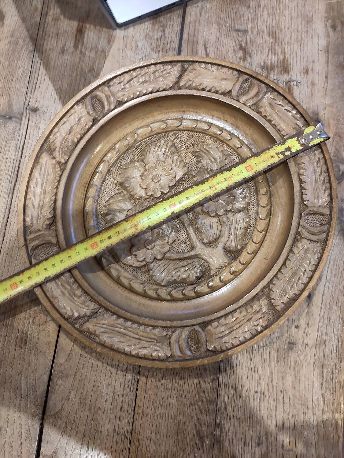 Round carved wooden dish