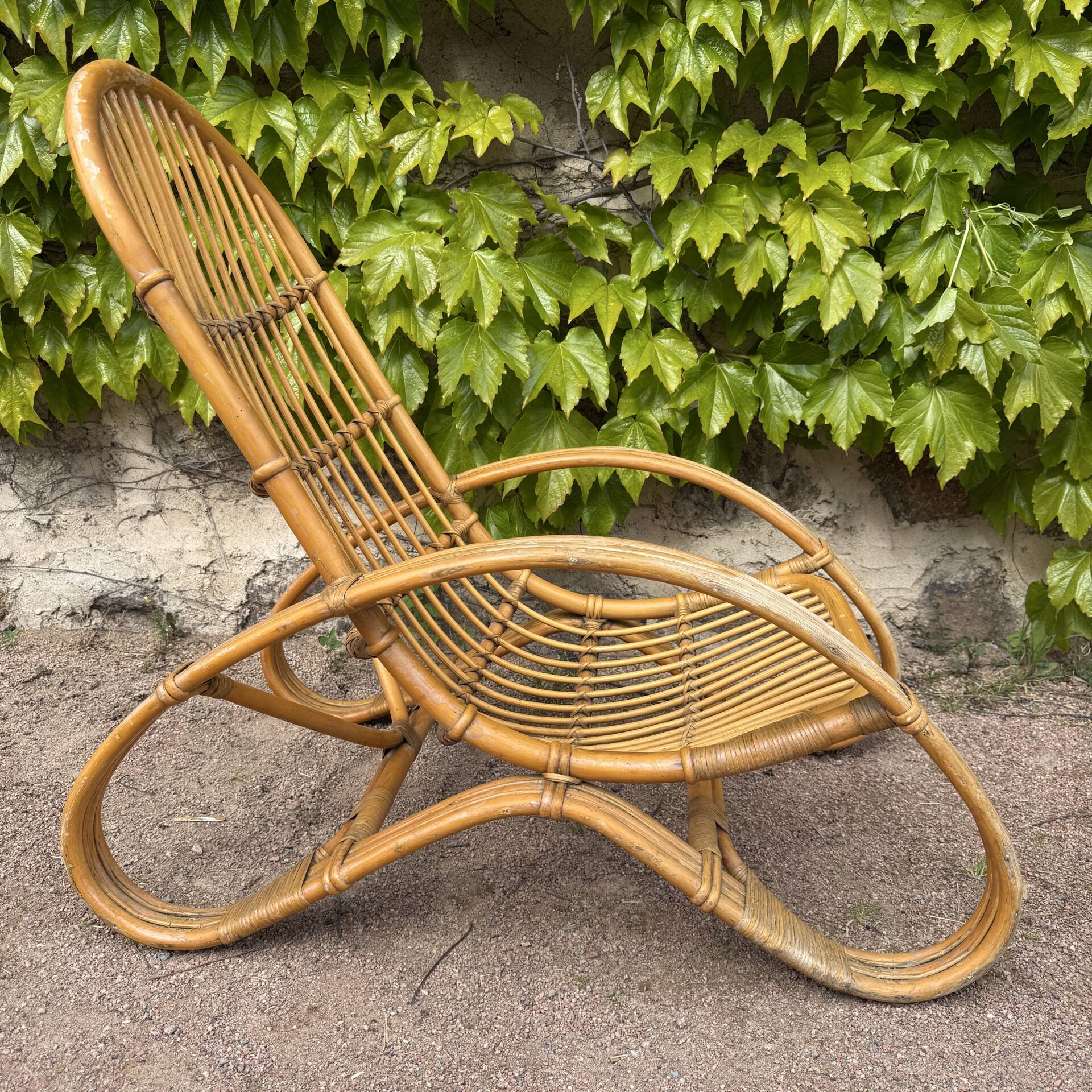 Curved bamboo and rattan armchair in Italian style by Roberti from the 1960s.