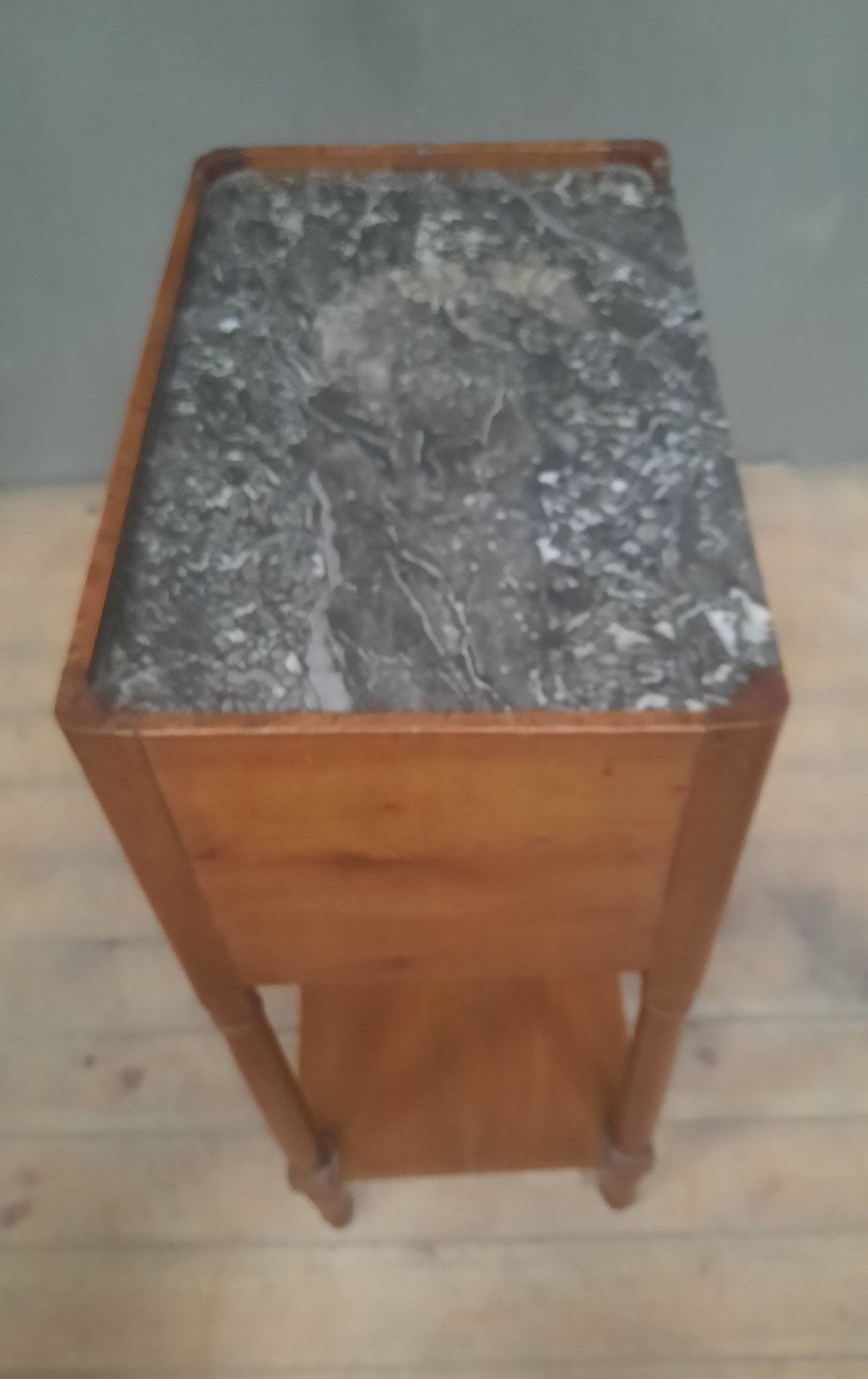 Curtained bedside table from the nineteenth century.