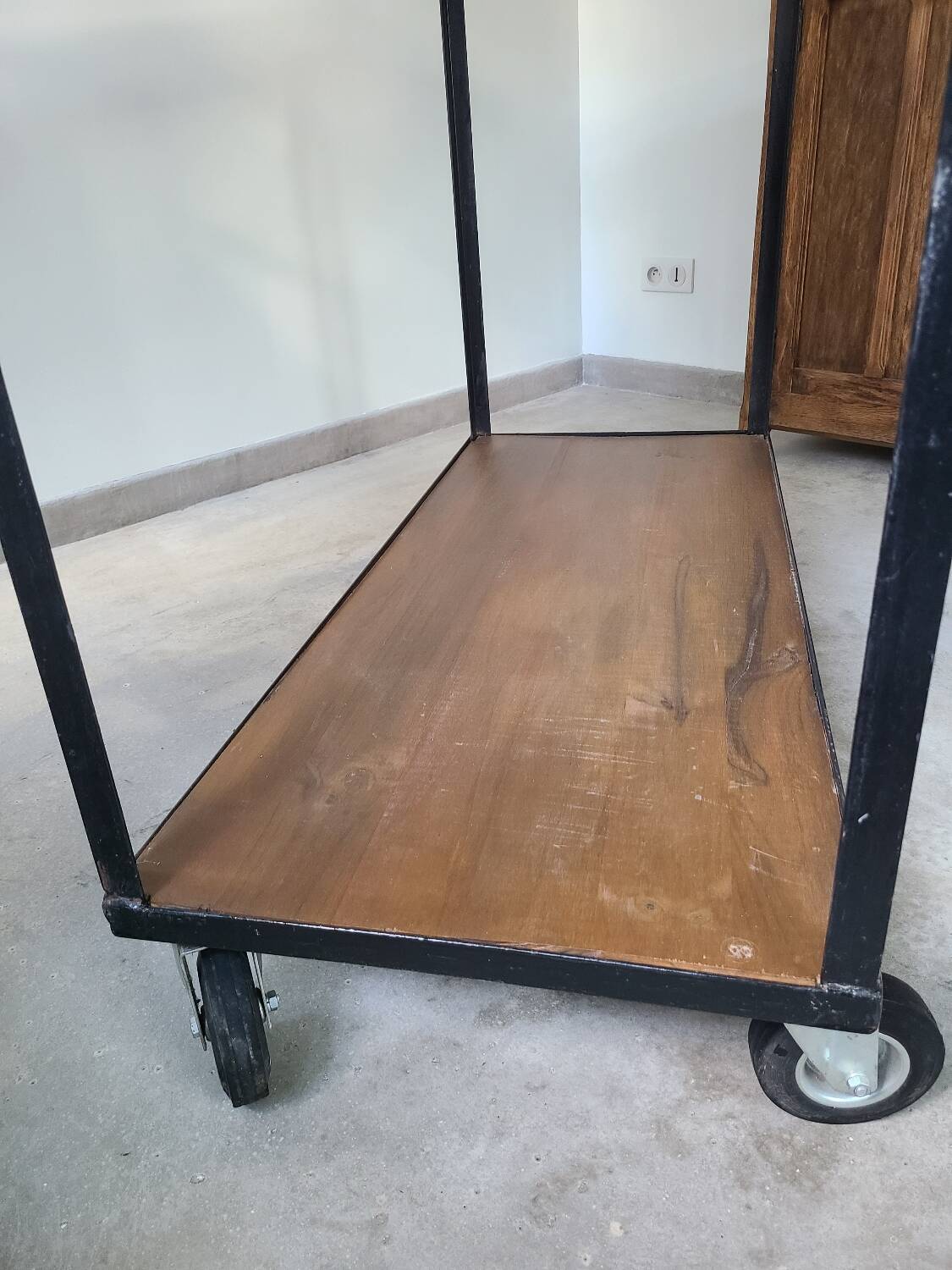 Large central kitchen island trolley on wheels serving industrial console
