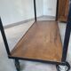 Large central kitchen island trolley on wheels serving industrial console