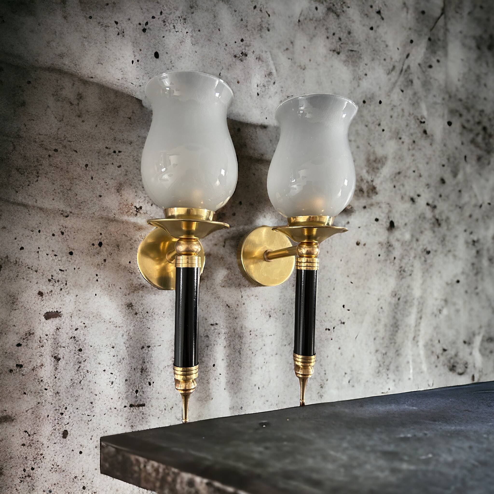 Pair of brass and black torchiere wall lights