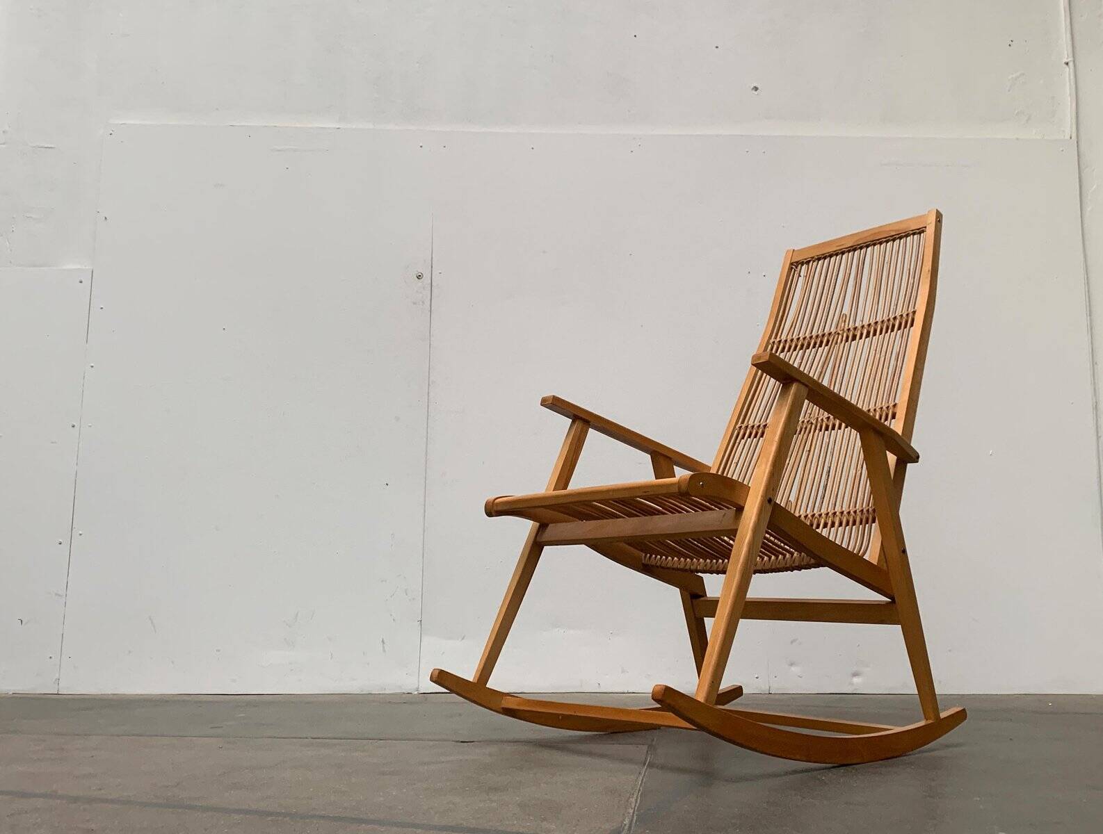 Mid-century German rattan rocking chair from Deutschen Werkstätten Hellerau, 1960s.