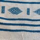 Traditional handmade white and blue kilim rug in natural wool