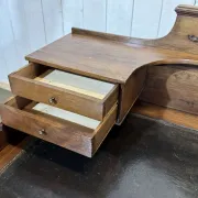Louis XVI style desk from the late 19th century in walnut with a leather top.