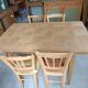 Oak dining table with a checkerboard top and extensions.