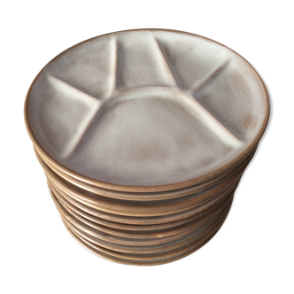 Series of 11 vintage sandstone plates with compartments