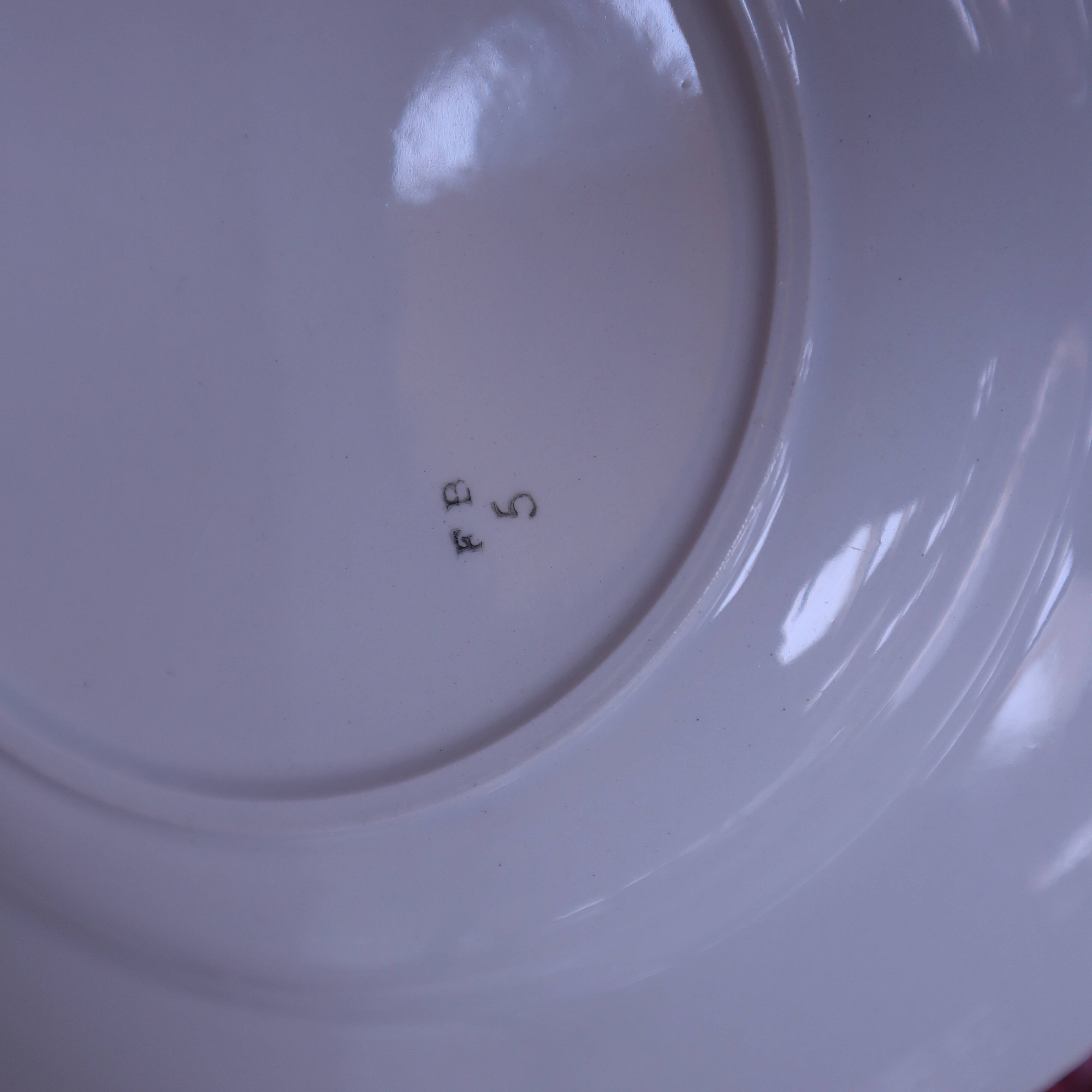 8 deep plates in half porcelain signed FB Floral decoration