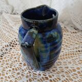 Antique pitcher in enamelled ceramic