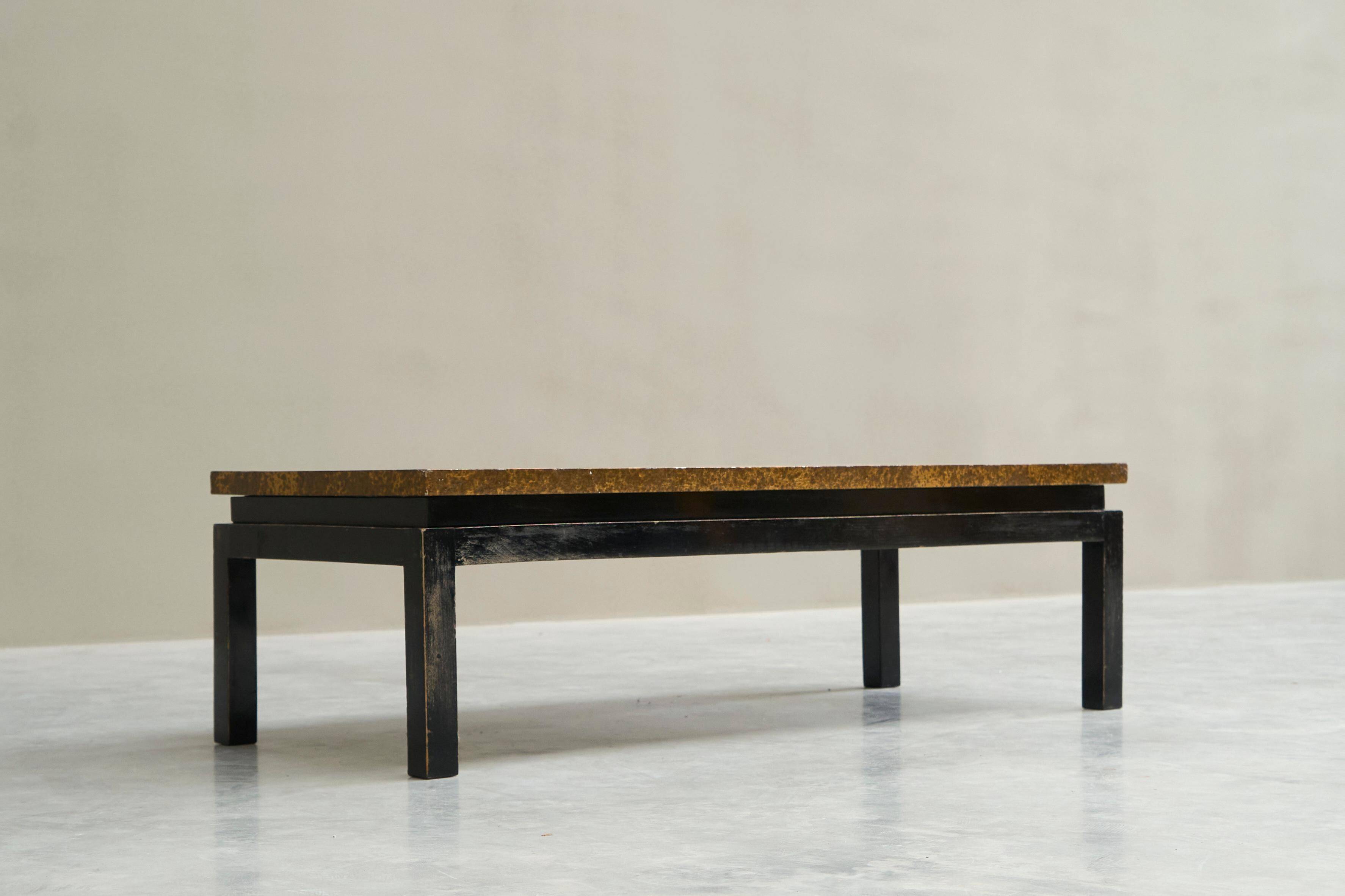 Modernist coffee table with a patinated gold top, 120x52.5x36 cm, mid-20th century.