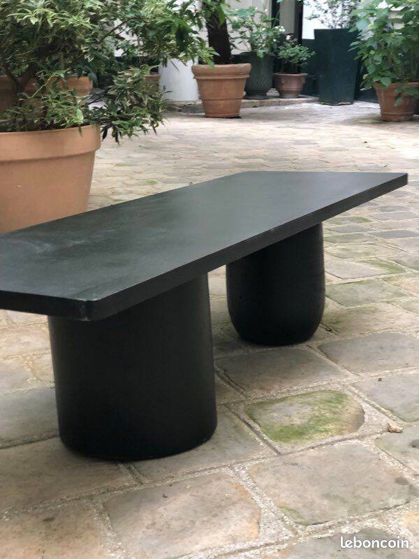 Rectangular coffee table in stained black wood with ball and cylindrical legs.