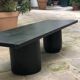 Rectangular coffee table in stained black wood with ball and cylindrical legs.