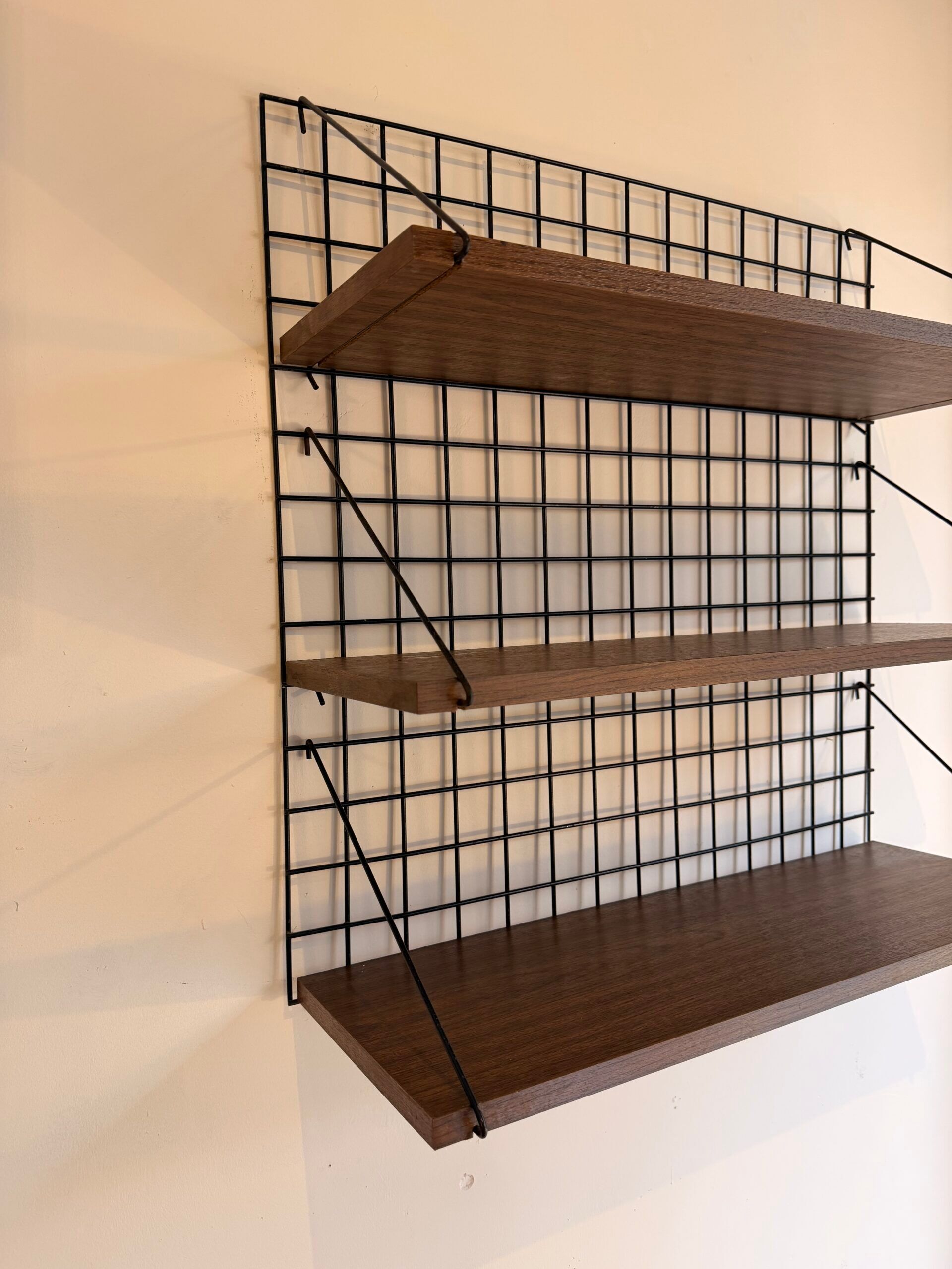 Vintage wall shelf from the 1970s.