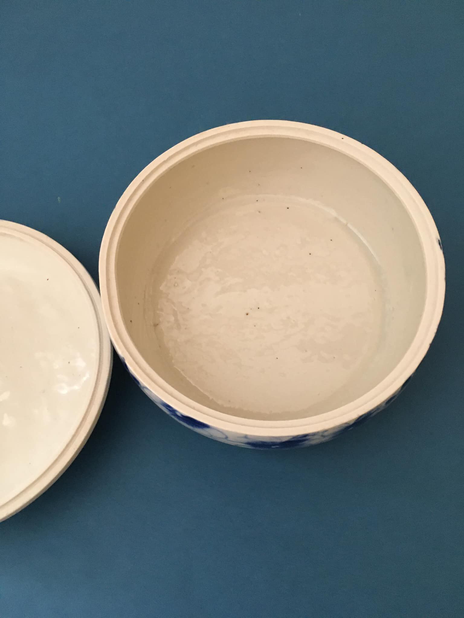 Porcelain candy dish. Blue flower patterns on white background