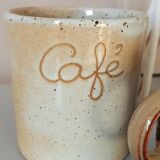 Coffee pot and mug cup in sandstone