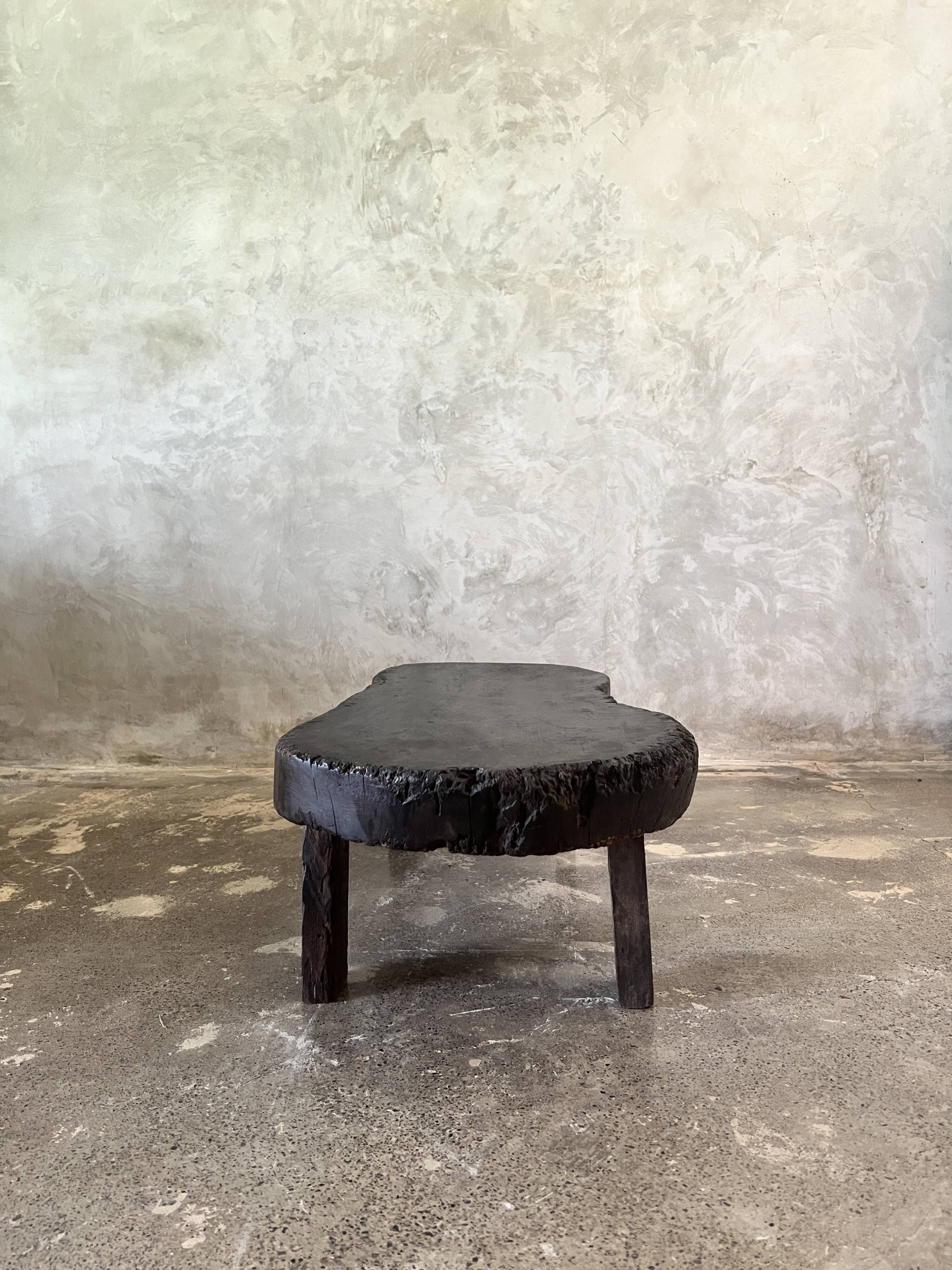 Small old Asian wooden coffee table in Japanese style, kidney-shaped top