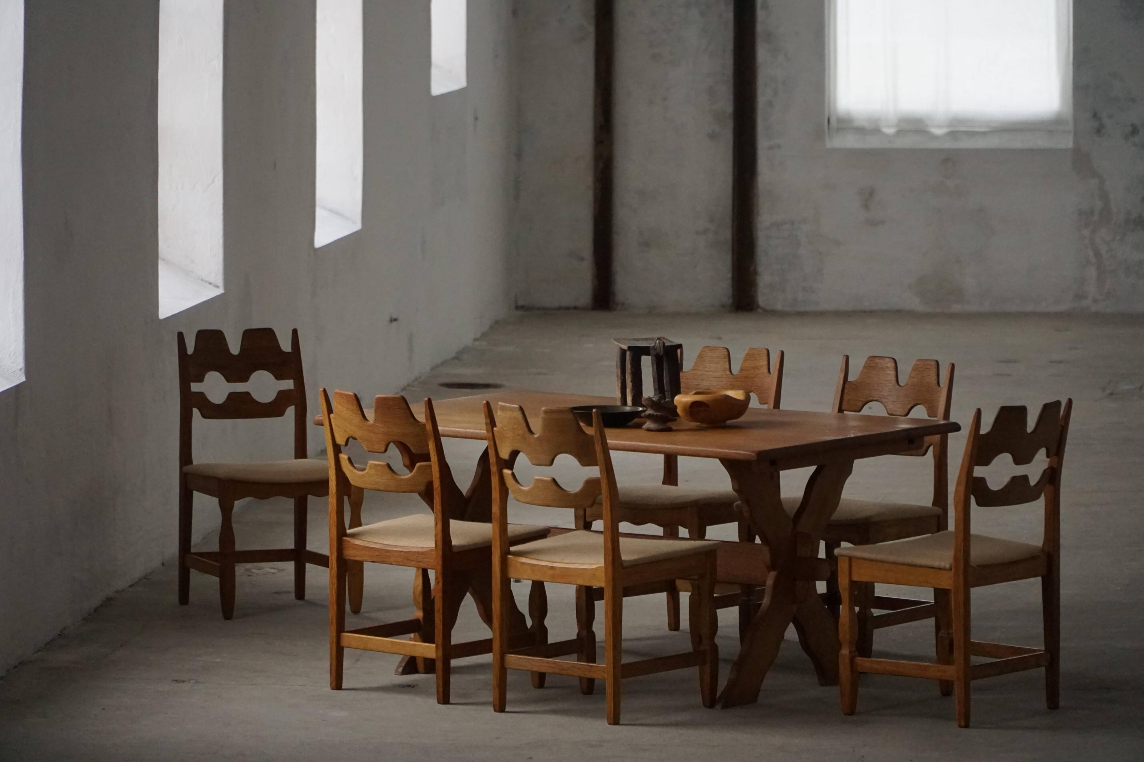 Solid oak dining table with cross base by Danish cabinetmaker, mid-20th century.